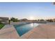 Modern, rectangular pool with a waterfall feature at 1999 Oliver Springs St, Henderson, NV 89052