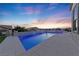 Relaxing pool with spa and water feature at sunset at 1999 Oliver Springs St, Henderson, NV 89052