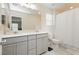 Bright bathroom featuring double sinks with ample counter space, modern fixtures, and a shower-tub combo at 2499 Adige Pl, Henderson, NV 89044