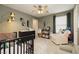 A Bedroom with a crib, dresser, reading corner and a cozy chair bathed in soft natural light at 2499 Adige Pl, Henderson, NV 89044