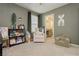 Cozy bedroom showcases a comfortable chair and delightful decor at 2499 Adige Pl, Henderson, NV 89044