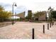 Expansive community gathering space features a shade structure, seating, bike racks, and beautifully maintained landscaping at 2499 Adige Pl, Henderson, NV 89044