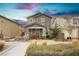 Charming two-story home featuring a cozy front porch and neutral color palette at 2499 Adige Pl, Henderson, NV 89044