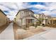 Two-story house with gray siding, brown door, landscaping, and a walkway at 2499 Adige Pl, Henderson, NV 89044