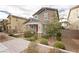 Charming two-story home with a cozy front porch and neat front yard landscaping at 2499 Adige Pl, Henderson, NV 89044