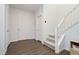 Bright foyer with sleek flooring, modern lighting, and a staircase leading upstairs at 2499 Adige Pl, Henderson, NV 89044