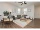 Bright and airy living room with modern decor, stylish furnishings, and ample natural light at 2499 Adige Pl, Henderson, NV 89044