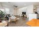 Open-concept living space featuring hardwood floors and a contemporary design at 2499 Adige Pl, Henderson, NV 89044