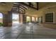 Charming outdoor seating area features overhead beams, stone columns, dining furniture, and a view of the pool at 2499 Adige Pl, Henderson, NV 89044