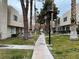 Landscaped community with walking paths and trees at 2611 Aracatuba Ave, Las Vegas, NV 89121