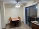 Small dining area with table and chairs near sliding door at 2611 Aracatuba Ave, Las Vegas, NV 89121