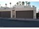 Two-car garage with brown doors and exterior access at 2611 Aracatuba Ave, Las Vegas, NV 89121
