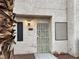 Neat townhouse exterior with security door and landscaping at 2611 Aracatuba Ave, Las Vegas, NV 89121