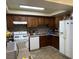 Kitchen with wood cabinets, gas stove and refrigerator at 2611 Aracatuba Ave, Las Vegas, NV 89121