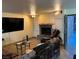 Living room with fireplace, large TV, and seating at 2611 Aracatuba Ave, Las Vegas, NV 89121