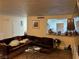 Living room with sectional sofa and view to kitchen at 2611 Aracatuba Ave, Las Vegas, NV 89121
