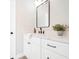 Modern bathroom with white cabinets and black fixtures at 2764 Carnation Ln # 0, Henderson, NV 89074