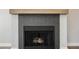 Modern fireplace with herringbone tile surround at 2764 Carnation Ln # 0, Henderson, NV 89074