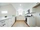 Modern kitchen with white cabinets, quartz countertops, and stainless steel appliances at 2764 Carnation Ln # 0, Henderson, NV 89074