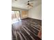 Spacious bedroom with wood-look floors and a ceiling fan at 300 Mahalko Ct, Henderson, NV 89012