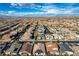 Aerial view of a well-planned community featuring beautiful desert homes with mountain views in the distance at 3009 Barrett Springs Ave, Henderson, NV 89044