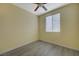 Simple bedroom with light walls and grey wood flooring at 3034 Scenic Valley Way, Henderson, NV 89052