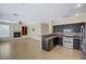 Kitchen features dark cabinetry, granite counters, and stainless steel appliances at 3034 Scenic Valley Way, Henderson, NV 89052