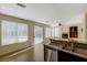 Kitchen with granite countertops, stainless steel appliances, and pool view at 3034 Scenic Valley Way, Henderson, NV 89052
