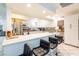 Open kitchen with white cabinets, stainless appliances, a center island, and bar stool seating at 3127 S Eastern Ave, Las Vegas, NV 89169