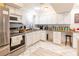 Bright kitchen with stainless appliances, white cabinetry, granite counters, and plenty of storage at 3127 S Eastern Ave, Las Vegas, NV 89169