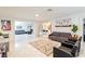 Open-plan living space with tile floors, comfortable seating, and modern decor at 3127 S Eastern Ave, Las Vegas, NV 89169