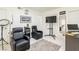 Inviting living room features tile floors, comfortable seating, and a modern entertainment setup at 3127 S Eastern Ave, Las Vegas, NV 89169