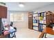Bright office with a large window, neutral walls, tile floors, and lots of storage for work or hobbies at 3127 S Eastern Ave, Las Vegas, NV 89169
