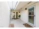 Private outdoor patio with decorative tile flooring and a sunlit, enclosed structure at 3127 S Eastern Ave, Las Vegas, NV 89169