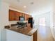 Kitchen with granite countertops and dark wood cabinets at 3351 Denali Preserve St, Las Vegas, NV 89122