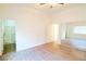 Main bedroom with wood-look floors and access to bathroom at 3351 Denali Preserve St, Las Vegas, NV 89122