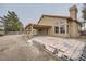 Rear view of house showing covered patio and landscaping at 4308 Bitterroot Dr, North Las Vegas, NV 89032