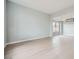 Light grey walls and light wood floors in a spacious living room at 4308 Bitterroot Dr, North Las Vegas, NV 89032