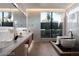 Luxurious bathroom with marble finishes, soaking tub, and double vanity at 4377 Cameron Brook Ct, Las Vegas, NV 89129