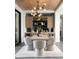 Contemporary dining room showcases a modern chandelier, built-in cabinets, and neutral tones at 4377 Cameron Brook Ct, Las Vegas, NV 89129
