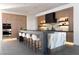 Contemporary kitchen boasts a large island with seating, modern cabinets, and stainless steel appliances at 4377 Cameron Brook Ct, Las Vegas, NV 89129
