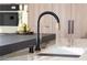 Sleek kitchen faucet with wood and marble details at 4377 Cameron Brook Ct, Las Vegas, NV 89129