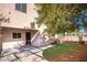 Landscaped backyard with artificial turf and patio at 5023 Tunnel Falls Dr, Las Vegas, NV 89141