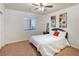 Bright bedroom with plush carpeting and a comfortable bed at 5023 Tunnel Falls Dr, Las Vegas, NV 89141