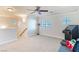 Spacious bonus room with neutral carpet and plenty of natural light at 5023 Tunnel Falls Dr, Las Vegas, NV 89141