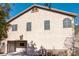 Two-story house with light-colored exterior and backyard at 5023 Tunnel Falls Dr, Las Vegas, NV 89141