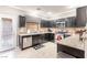 Modern kitchen featuring granite countertops and stainless steel appliances at 5023 Tunnel Falls Dr, Las Vegas, NV 89141