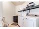 Convenient laundry room with washer, dryer, and shelving at 5023 Tunnel Falls Dr, Las Vegas, NV 89141