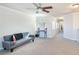 Spacious loft area with a sofa and ceiling fan at 5023 Tunnel Falls Dr, Las Vegas, NV 89141