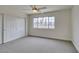Bedroom features plush carpeting, a bright window, and built-in closet storage at 5416 Lochmor Ave, Las Vegas, NV 89130